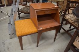 A vintage teak telephone table, labelled Chippy