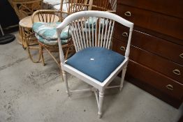 A Victorian style corner chair having later painted turned frame and blue upholstered seat