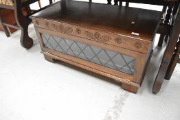 A late C20th oak effect TV base unit