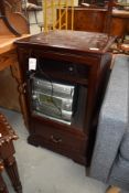 A modern mahogany music cabinet and Alba music centre