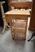 A modern beech or rubberwood kitchen trolley