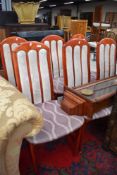 A set of six stained frame and partially reupholstered dining chairs