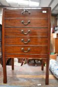 An early 20th Century mahogany five drawer music cabinet