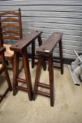 A pair of stained frame trestles