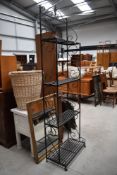 A modern wrought iron shelf, height approx. 210cm