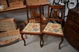 A pair of early 20th Century mahogany bedroom chairs