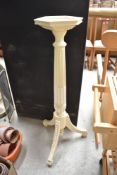 A traditional painted Adams style jardiniere stand having hexagonal top