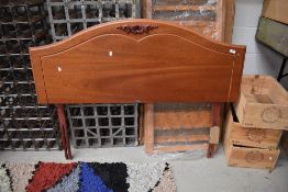 A modern mahogany double headboard, labelled Myers