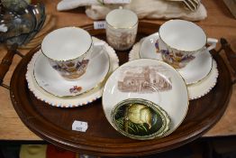An antique wooden tray and a selection of commemorative ware.