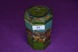A vintage novelty octagonal shaped Grand National game tin, with lid having a spinning top,which