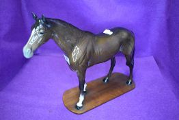A Beswick study, Large Racehorse, brown, model no 1564, fixed to a home made plinth