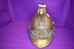 A late 19th/early 20th century French fire fighters brass helmet ' Pompiers D'ypres' no lining