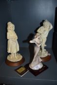 Three figurines including dancing lady.