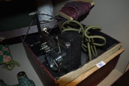 A Kodascope model C film projector and accessories
