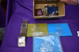 A collection of World Coins including 1971 Gambia Sets, 1974 & 1982 Falklands Islands Sets, 1883 USA