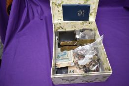 A collection of GB and World Coins and Banknotes, a pack of GB 1st Class Stamps and a brass military