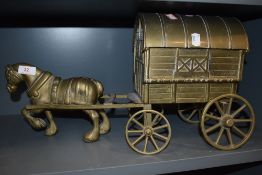 A large brass cast figure of a shire horse and gypsy caravan