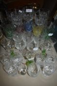An assortment of vintage glass including etched and coloured examples.