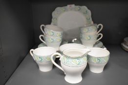 A selection of tea cups and saucers by Bell china in an art deco design