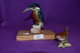 A ceramic figure of a kingfisher hand decorated with a similar Beswick wren