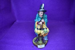 A Royal Doulton Figurine, The Mask Seller HN2103