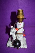 A mid century small ceramic table lamp having kitsch style figure of foal