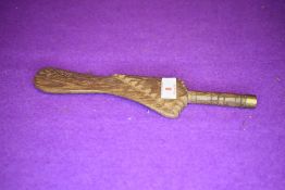 An antique knitting stick or distaff in hardwood having carved decoration