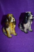 Two cocker spaniel figurines.