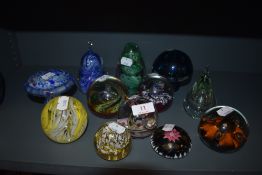 A selection of art glass paper weights and glass mushroom including Caithness and Selkirk