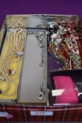 A small selection of costume jewellery including strings of beads, diamante wrist watch etc