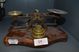 A set of antique chemist or apothecary scales with accompanying weight set