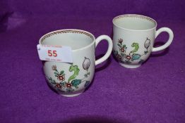A pair of late 18th century Worcester style chocolate cups having floral pattern and burgundy