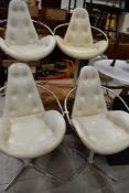 A vintage set of four 1970's atomic space age styled dining chairs on chrome frames with white