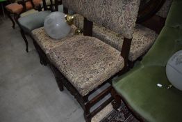 A set of four priory style oak dining chairs
