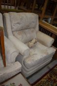 A modern three piece lounge suite having cream upholstery, very clean and tidy