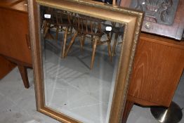 A modern wall mirror, having crackle gilt effect frame