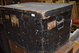 A vintage wooden travel trunk, including vintage shipping labels relating to Blue Star Line and Gold