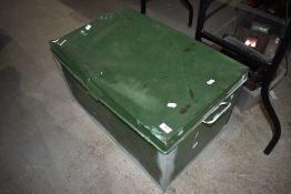 A vintage metal tin trunk or bedding box