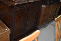 A Victorian mahogany shallow sideboard, two small drawers over double cupboard, on scroll feet