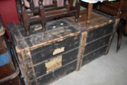A vintage travel trunk or bedding box having distressed paint work with badges for blue star etc W50