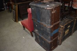 A vintage hard bodied travel trunk with wooden ribs