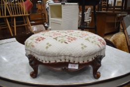 A small well carved mid 18th century foot stool