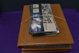 A collection of Royal Mail Presentation Packs in two albums and loose, 1970's to 1990's total face