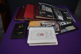 A box of World Stamps on Cards and in Albums, Mint & Used