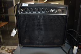 A Fender Squier 15 practice amp
