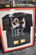 A framed and glazed concert t shirt and gig tickets for Simon and Garfunkle from the 2004 tour
