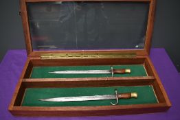 Two miniature possibly French Gras Rifle Bayonets, blade length 26cm, overall length 33cm, no