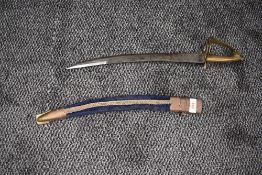 A small Indian Sword, possibly for a child, floral decoration to blade, stamped Made In India,