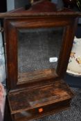 A vintage hall way mirror having internal drawer
