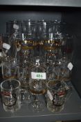 A selection of wine and similar glasses including gold and etched designs